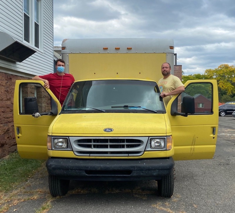 Jamie and helper with truck